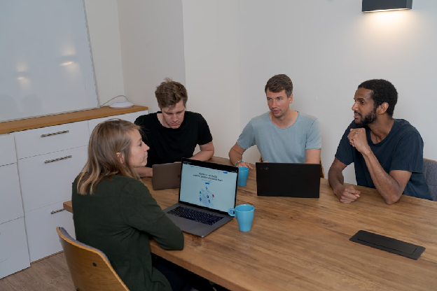 Startup team discussing CRM tools